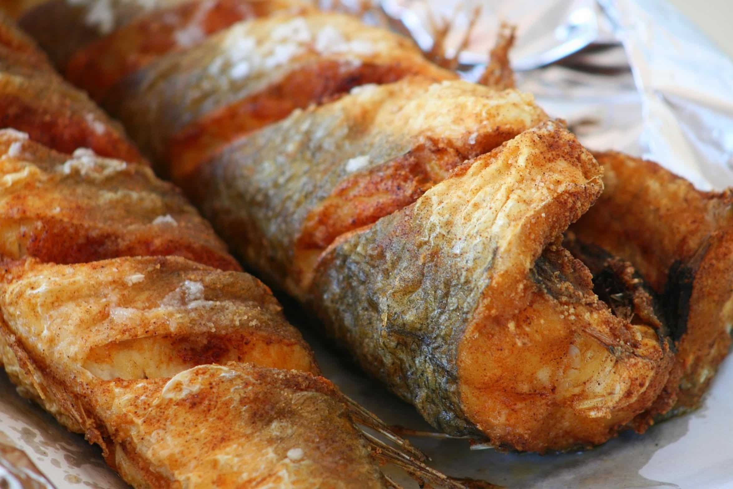 fried fish in skillet fried fish in skillet