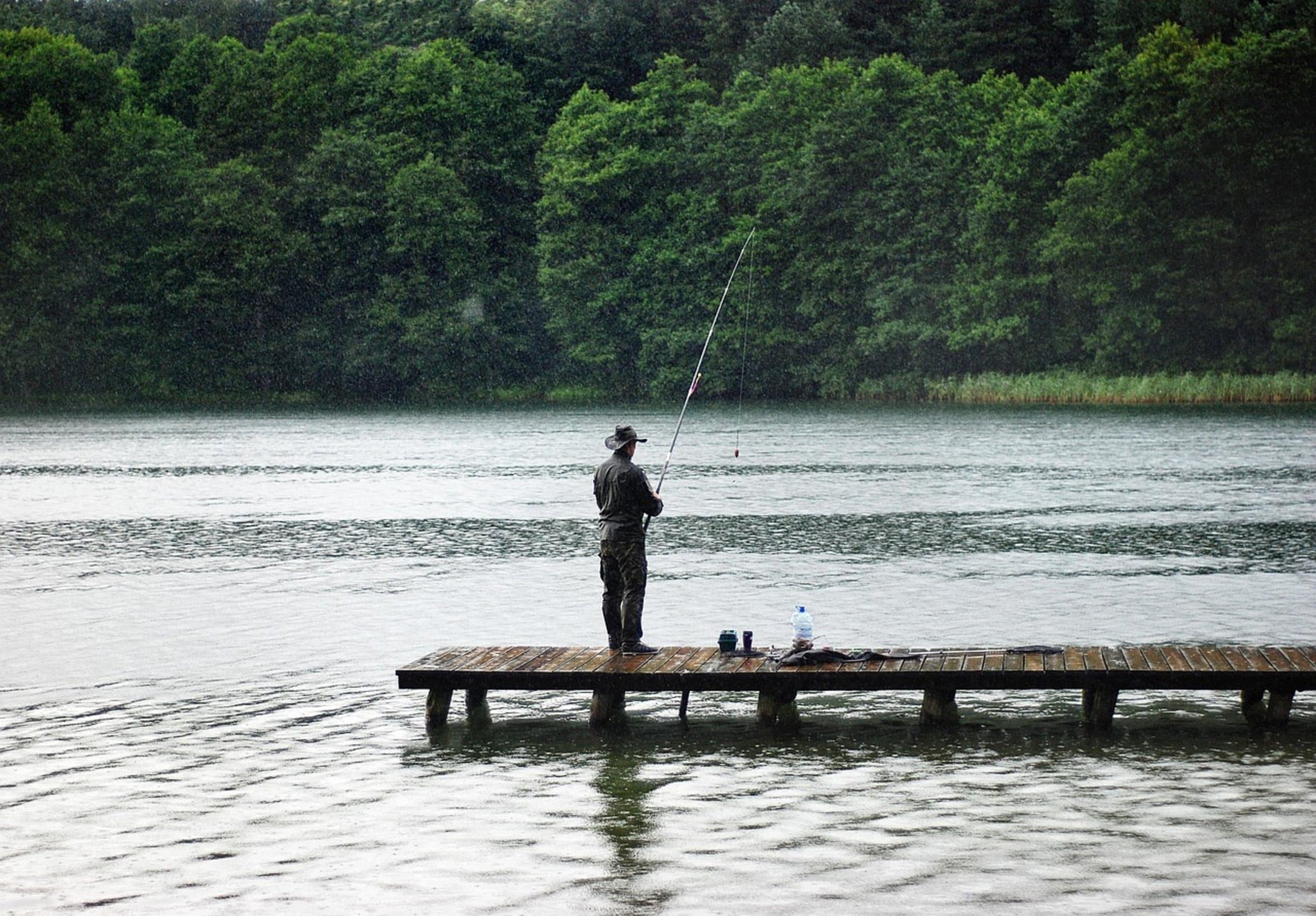 man fishing lake man fishing lake